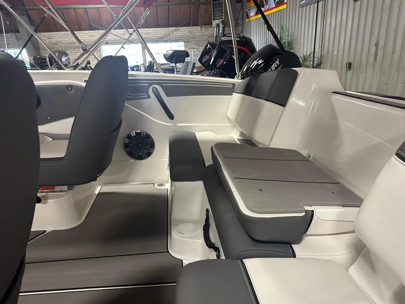 Slide: The Image of Interior of 2025 Tahoe T21 boat with modern seating and sleek design. - 11