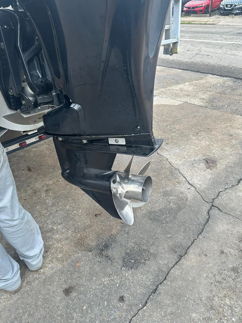 Slide: The Image of 2025 Tahoe T21 boat motor with stainless steel propeller on a concrete surface. - 13