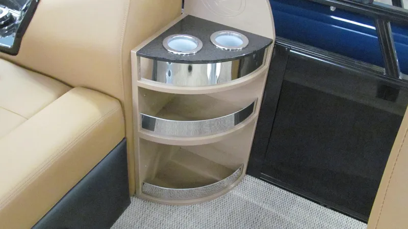 Slide: The Image of 2025 Regency 250 LE3 Sport interior with cup holders and beige seating. - 13