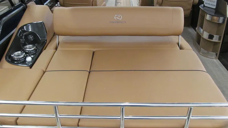 Slide: The Image of 2025 Regency 250 LE3 Sport boat with tan seating and sleek design. - 17