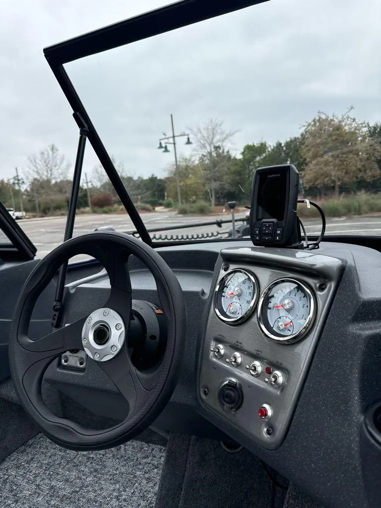 Slide: The Image of 2025 Tracker Pro Guide V-16 WT dashboard with steering wheel and gauges. - 6