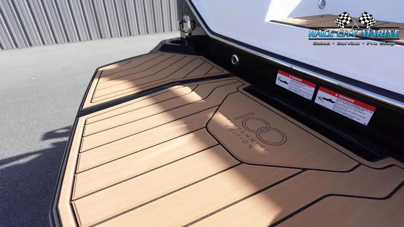 Slide: The Image of 2025 Nautique Super Air Nautique S23 swim platform with teak finish. - 11