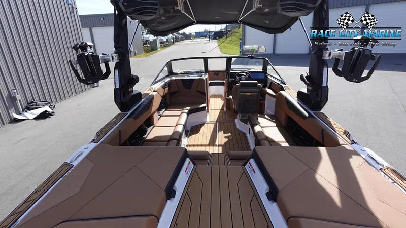 Slide: The Image of 2025 Nautique Super Air Nautique S23 interior with luxurious seating and advanced features. - 15