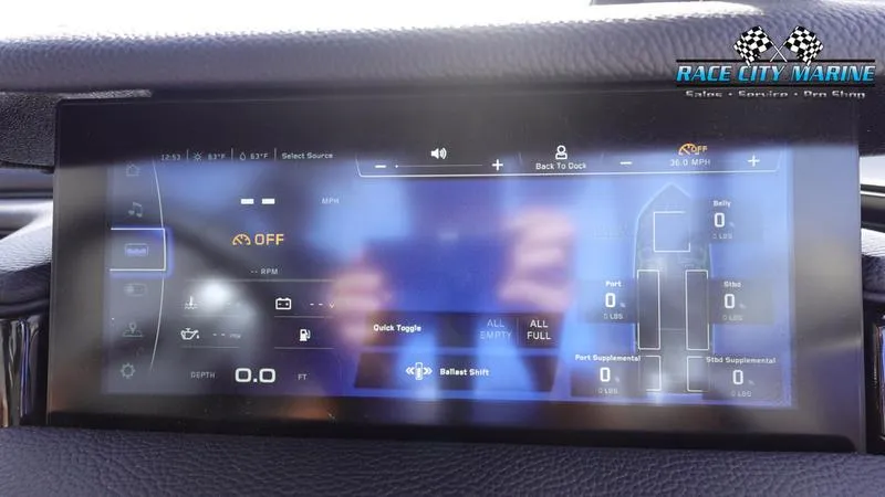 Slide: The Image of 2025 Nautique Super Air Nautique S23 touchscreen dashboard display with control options. - 37