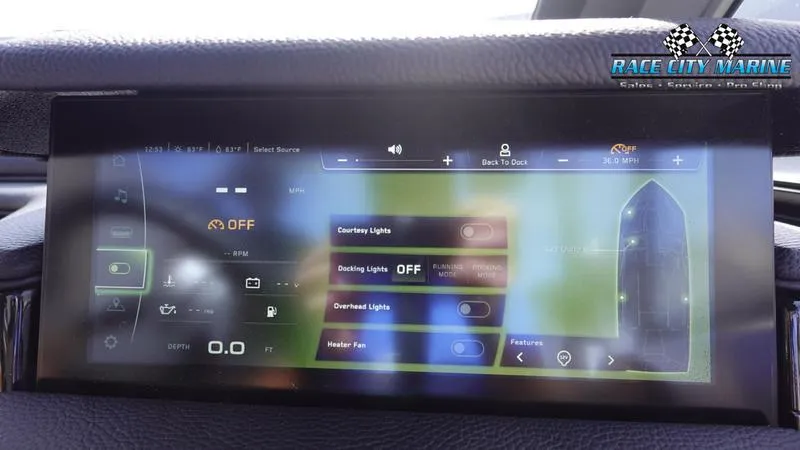 Slide: The Image of 2025 Nautique Super Air Nautique S23 touchscreen control panel displaying lighting and fan settings. - 38