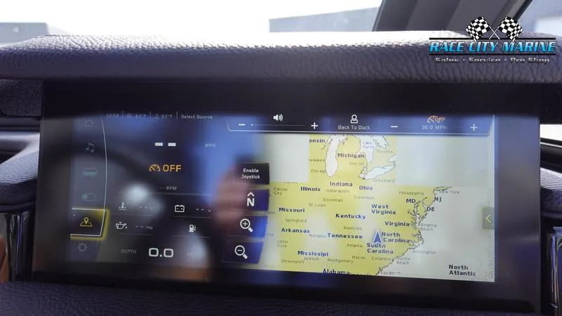Slide: The Image of 2025 Nautique Super Air Nautique S23 touchscreen display with navigation map. - 39