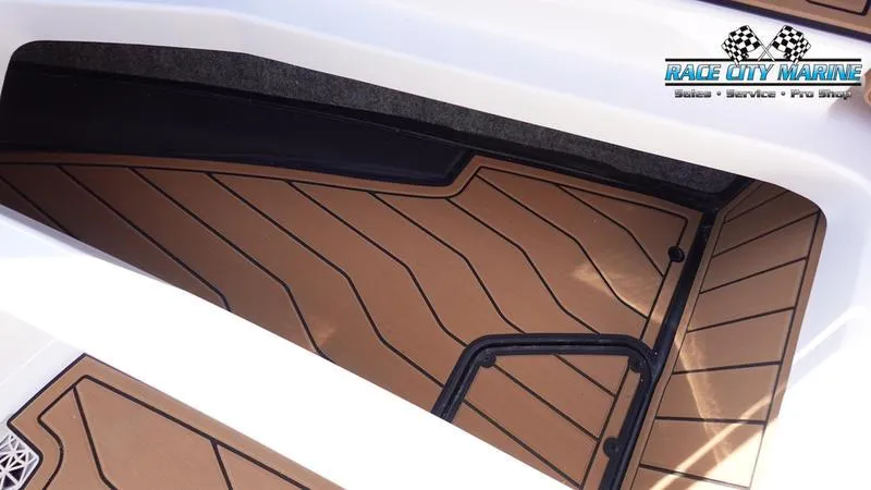 Slide: The Image of 2025 Nautique Super Air Nautique S23 boat flooring detail, Race City Marine logo. - 44