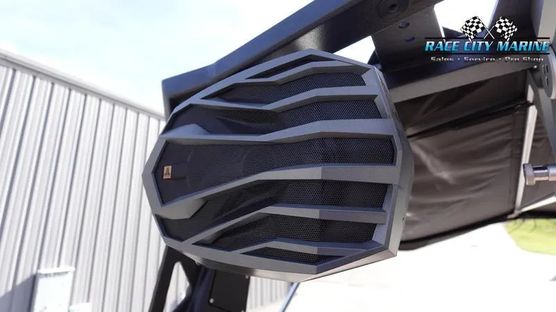 Slide: The Image of 2025 Nautique Super Air Nautique S23 boat speaker detail, Race City Marine branding. - 47