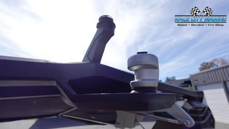 Slide: The Image of Close-up of 2025 Nautique Super Air Nautique S23 boat component under bright sky. - 48