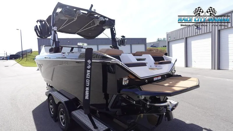 Slide: The Image of 2025 Nautique Super Air Nautique S23 boat at Race City Marine dealership. - 7