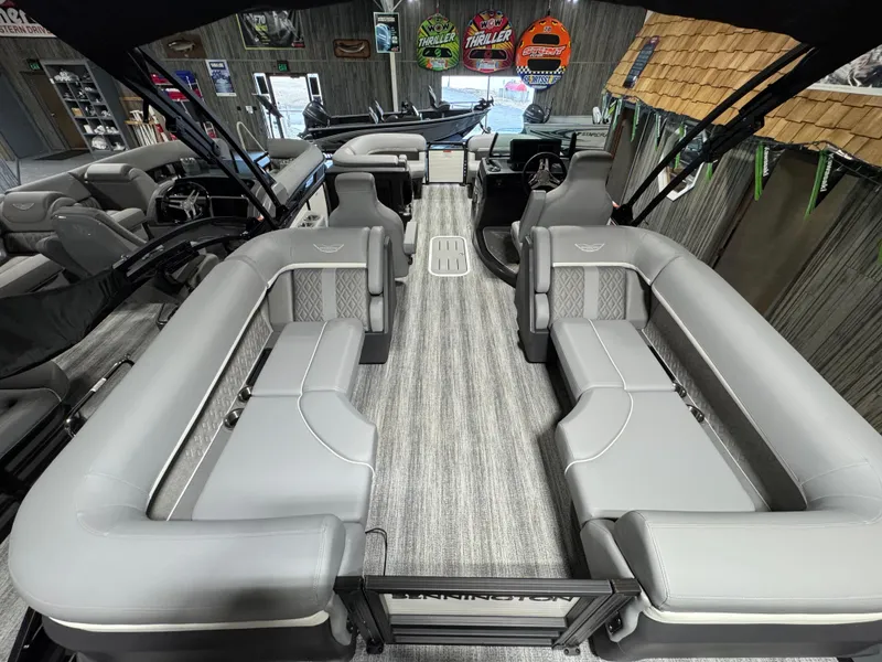 Slide: The Image of 2025 Bennington 22 MFB pontoon boat interior with gray seating and modern design. - 10