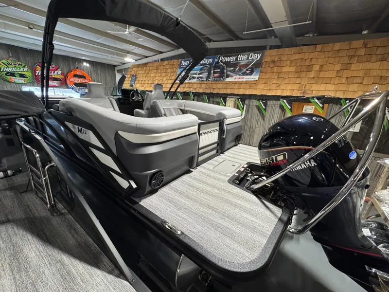 Slide: The Image of 2025 Bennington 22 MFB boat with Yamaha motor in showroom display. - 11