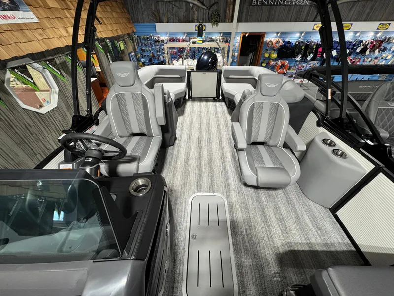 Slide: The Image of Interior of 2025 Bennington 22 MFB boat with modern seating and steering wheel. - 5