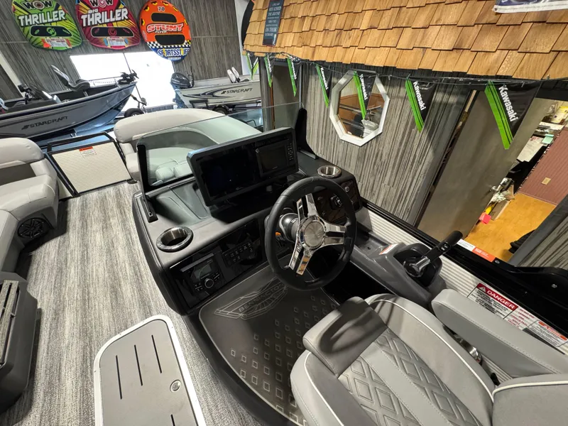 Slide: The Image of Interior of 2025 Bennington 22 MFB boat with modern dashboard and steering wheel. - 8