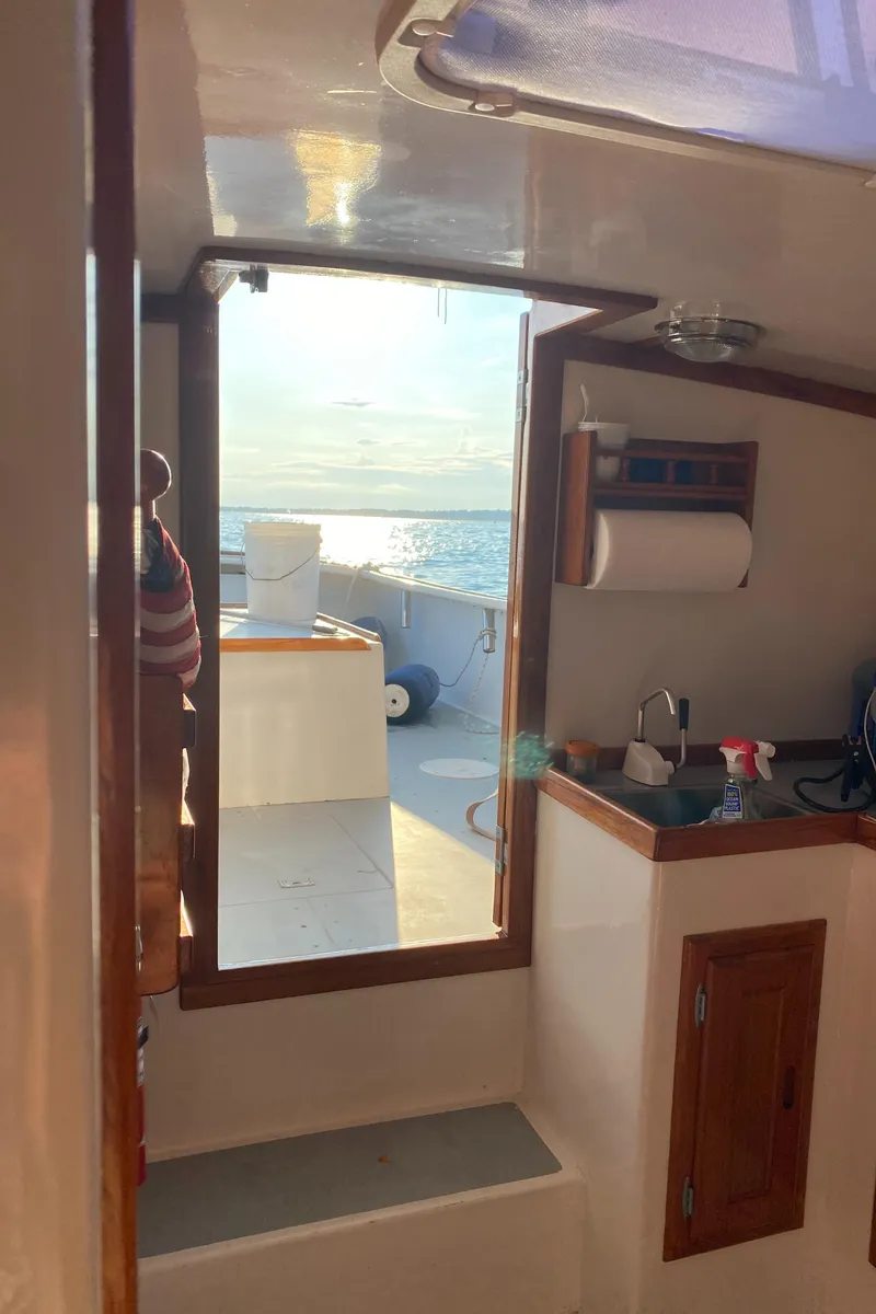 Slide: The Image of Interior view of 1992 Duffy 26' boat with ocean backdrop. - 14