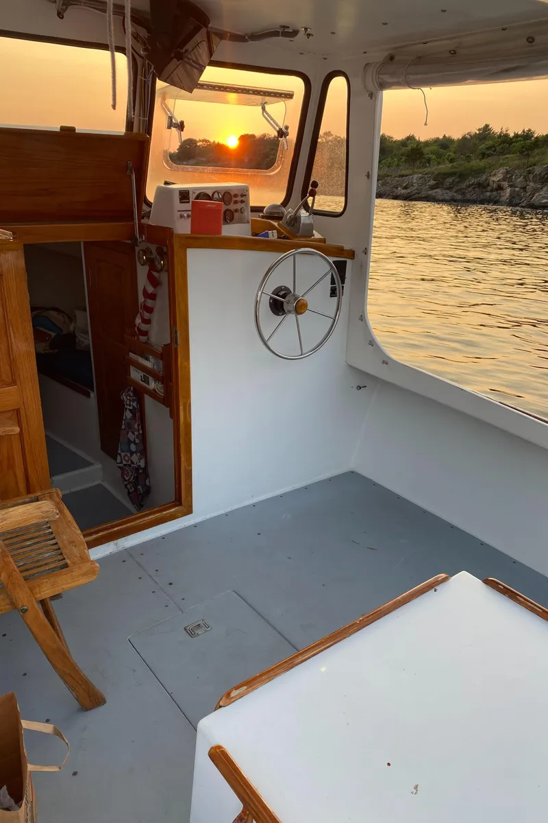 Slide: The Image of Interior of 1992 Duffy 26' boat at sunset on calm water. - 3