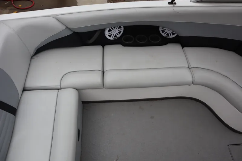 Slide: The Image of 2006 Moomba Outback LSV interior with gray seating and built-in speakers. - 11