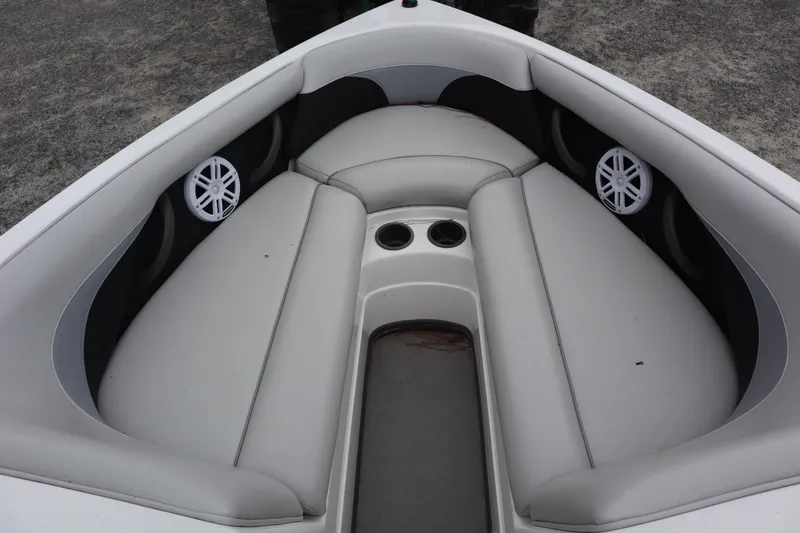 Slide: The Image of 2006 Moomba Outback LSV boat interior with gray seating and cup holders. - 13