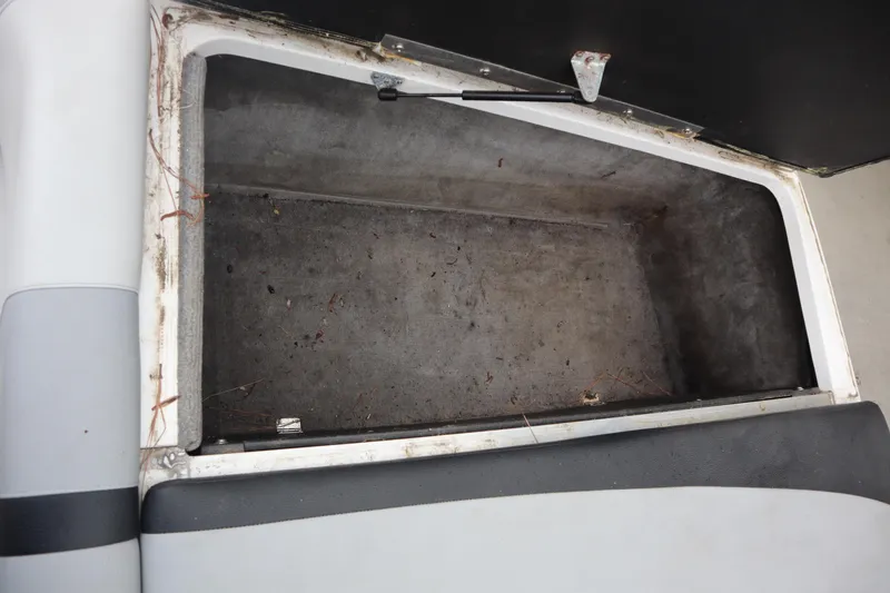 Slide: The Image of Storage compartment of a 2006 Moomba Outback LSV boat, open and empty. - 5
