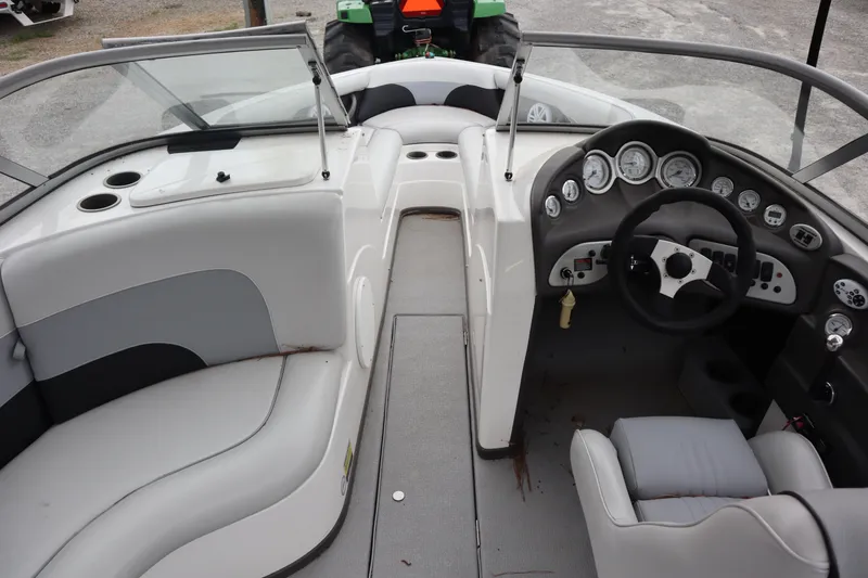 Slide: The Image of 2006 Moomba Outback LSV boat interior with steering wheel and seating. - 6