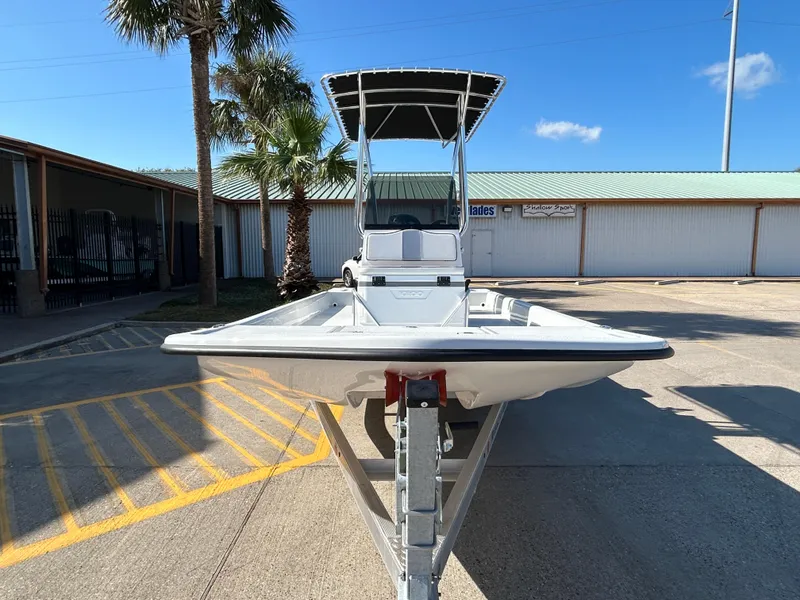 Slide: The Image of Shallow Stalker Cat 204 boat, 2025 model, parked outdoors under clear blue sky. - 3