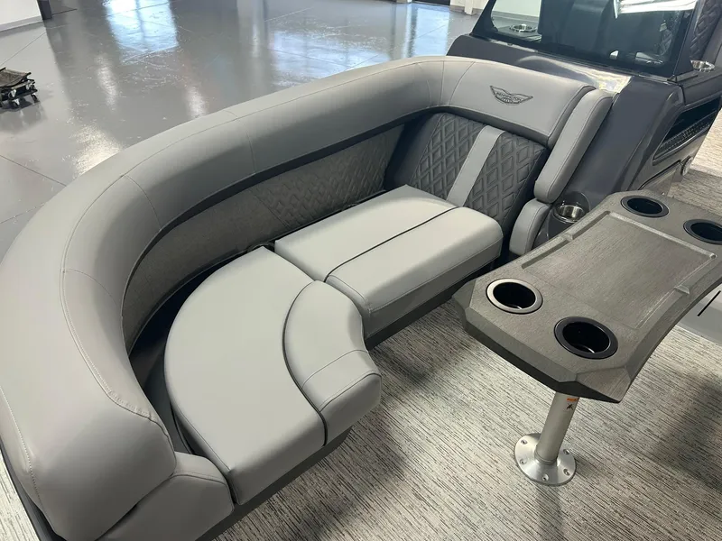 Slide: The Image of Luxurious seating on 2025 Bennington 22 MSB pontoon boat with cup holders and elegant design. - 10