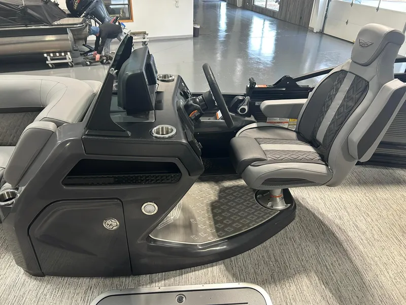 Slide: The Image of 2025 Bennington 22 MSB boat interior with modern helm and comfortable seating. - 11