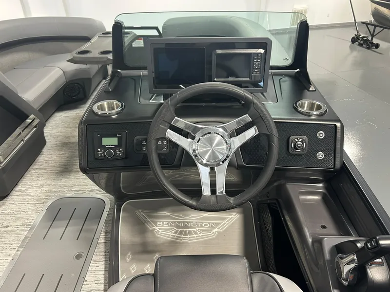 Slide: The Image of Cockpit of 2025 Bennington 22 MSB boat with modern steering and dual displays. - 12