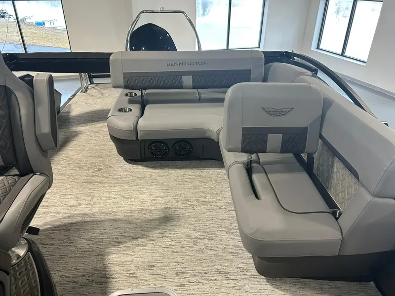 Slide: The Image of 2025 Bennington 22 MSB boat interior with gray seating and modern design. - 14