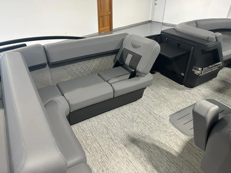 Slide: The Image of 2025 Bennington 22 MSB boat interior with gray seating and modern design. - 15
