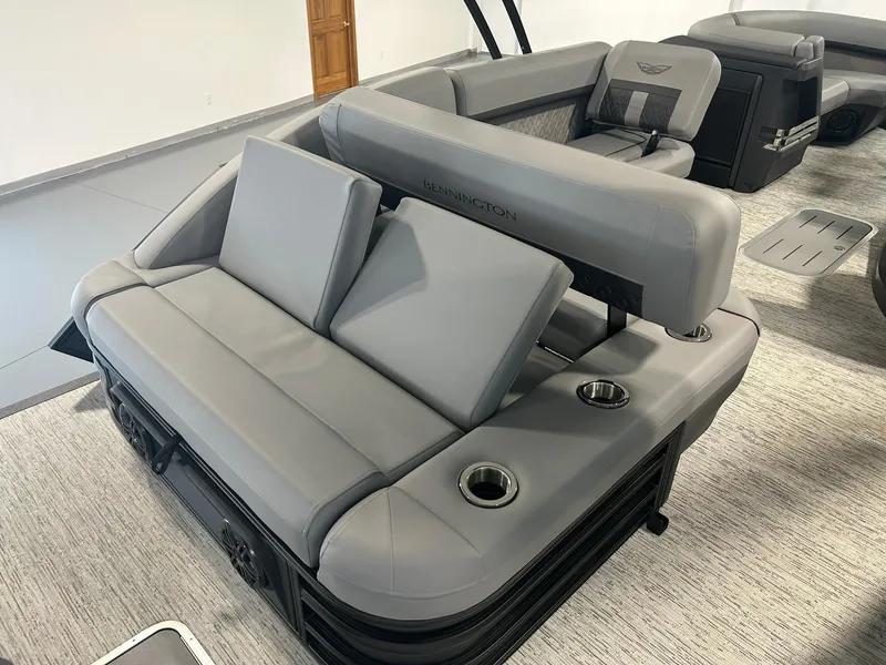Slide: The Image of 2025 Bennington 22 MSB boat interior with gray seating and cup holders. - 17