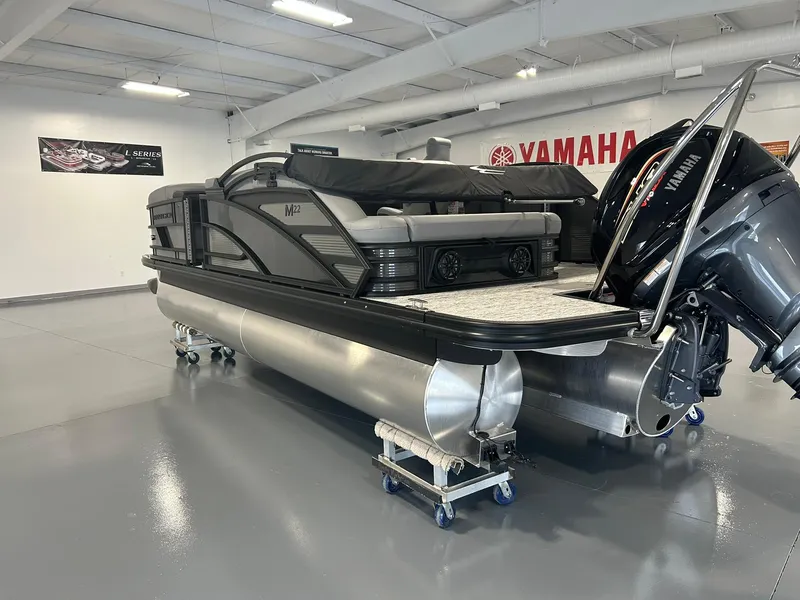 Slide: The Image of 2025 Bennington 22 MSB pontoon boat in showroom with Yamaha engine. - 5