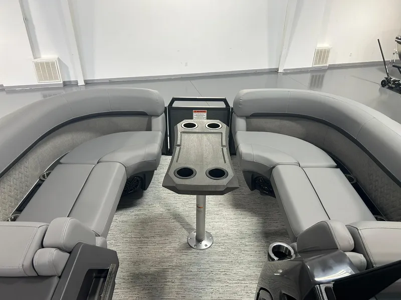 Slide: The Image of 2025 Bennington 22 MSB boat interior with gray seating and table. - 8