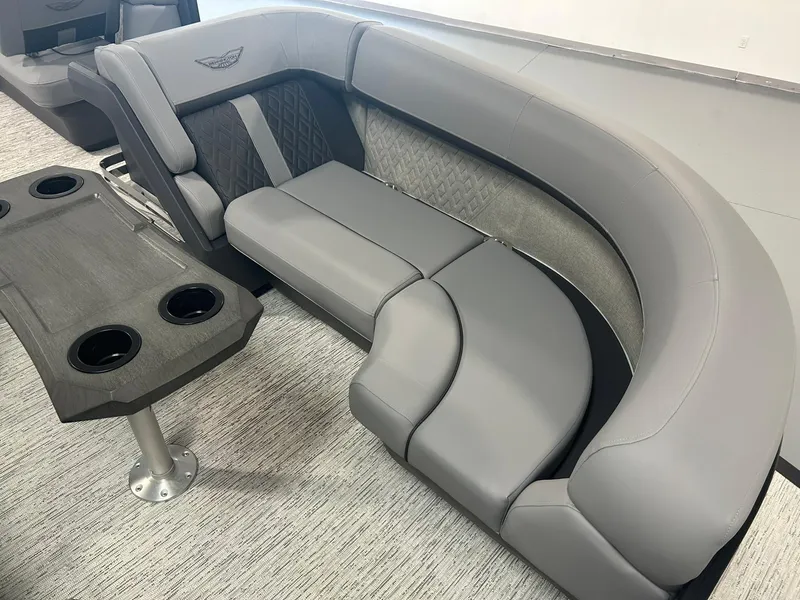 Slide: The Image of 2025 Bennington 22 MSB boat interior with luxurious gray seating and cup holders. - 9