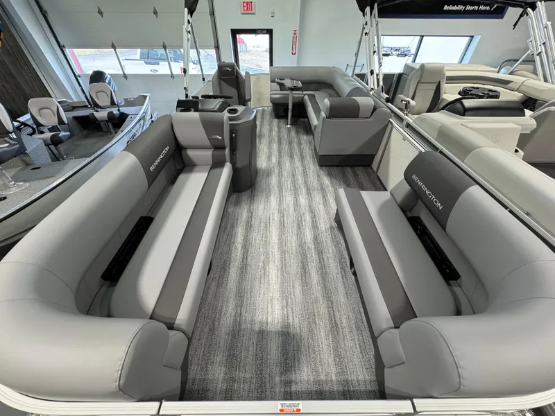 Slide: The Image of 2025 Bennington 20 SL pontoon boat interior with gray seating and modern design. - 2