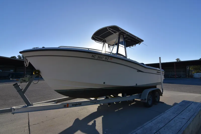 The Image of 2005 Grady-White Escape 209 boat on trailer in outdoor setting. - 1