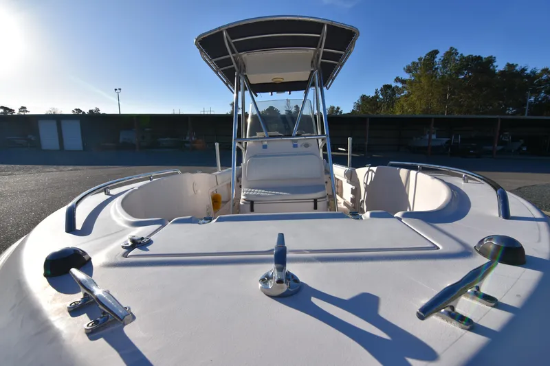 Slide: The Image of 2005 Grady-White Escape 209 boat with center console and canopy in a sunny outdoor setting. - 10