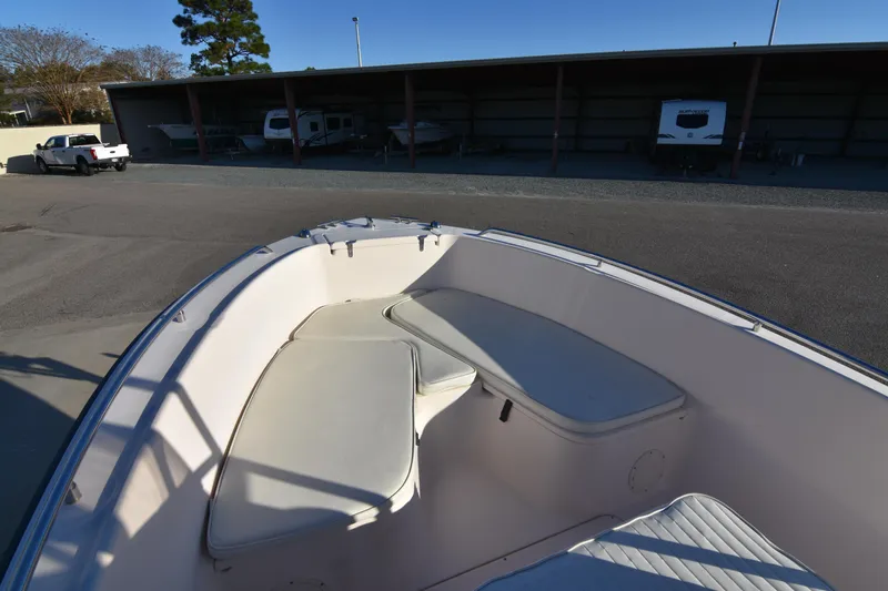 Slide: The Image of 2005 Grady-White Escape 209 boat interior with seating, parked in storage area. - 11