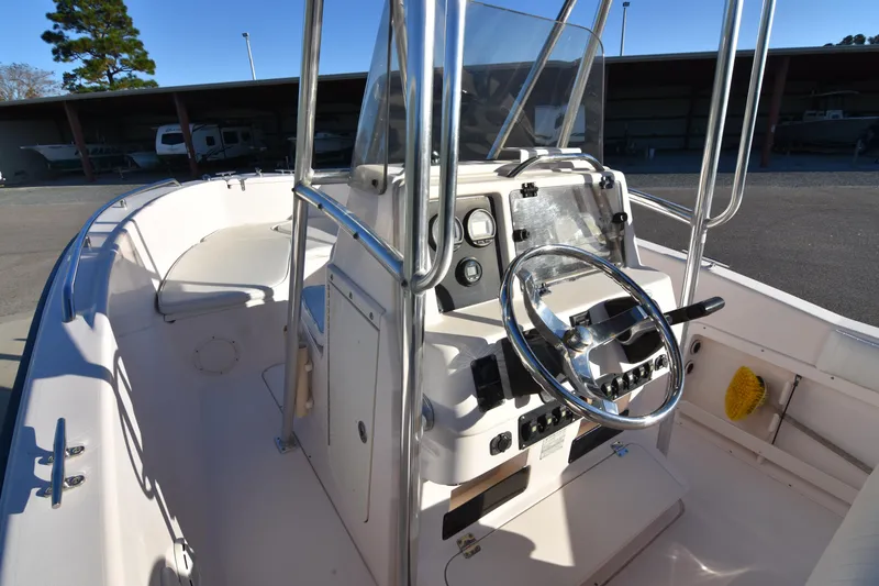 Slide: The Image of 2005 Grady-White Escape 209 boat interior with steering console and controls. - 12