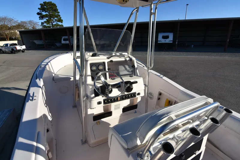 Slide: The Image of 2005 Grady-White Escape 209 boat interior with steering console and seating. - 13