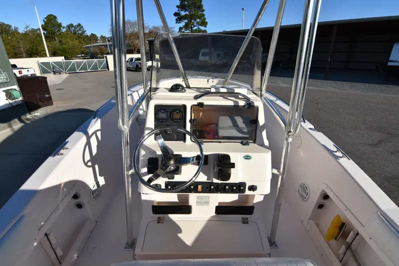 Slide: The Image of 2005 Grady-White Escape 209 boat cockpit with steering wheel and controls. - 14