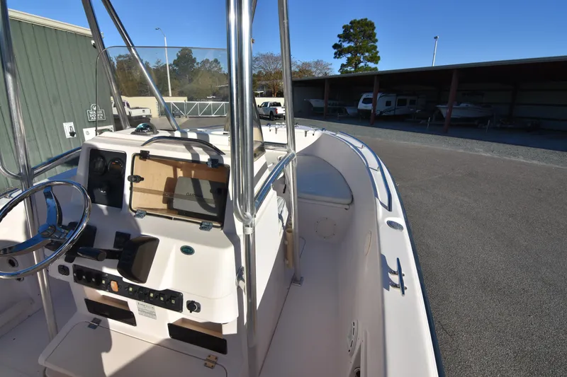 Slide: The Image of 2005 Grady-White Escape 209 boat interior, featuring steering console and spacious deck. - 15