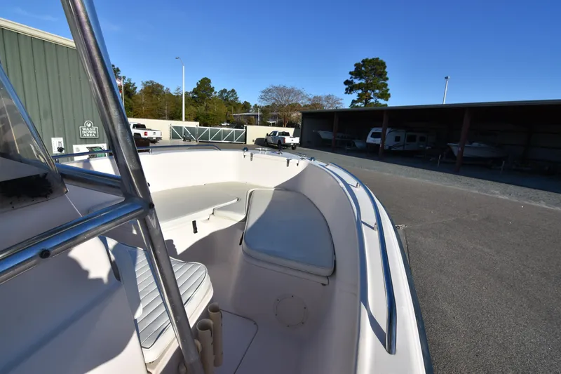 Slide: The Image of 2005 Grady-White Escape 209 boat interior with seating, parked outdoors. - 16