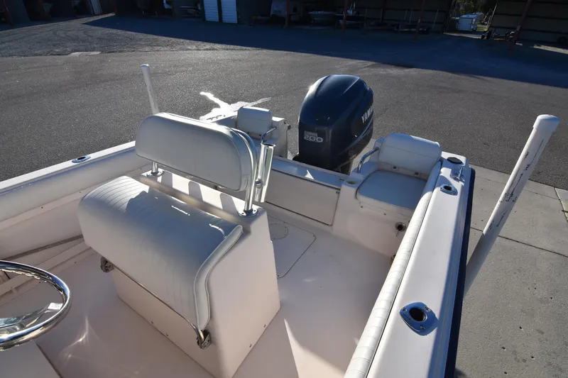 Slide: The Image of 2005 Grady-White Escape 209 boat interior with Yamaha outboard motor. - 19
