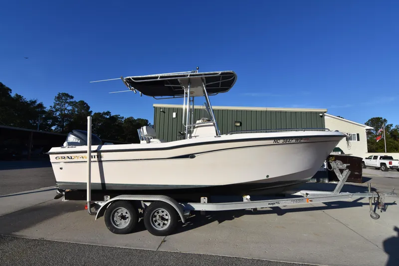 Slide: The Image of 2005 Grady-White Escape 209 boat on trailer, parked outdoors. - 6