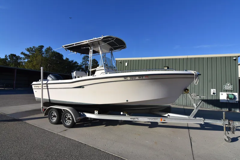 Slide: The Image of 2005 Grady-White Escape 209 boat on trailer, parked outdoors. - 7