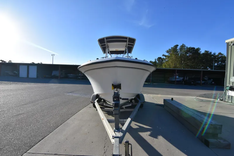 Slide: The Image of 2005 Grady-White Escape 209 boat on trailer in sunny outdoor setting. - 9