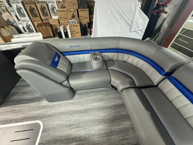 Slide: The Image of Luxurious seating on 2025 Bennington 24 LXSSB pontoon boat, featuring gray and blue upholstery. - 3