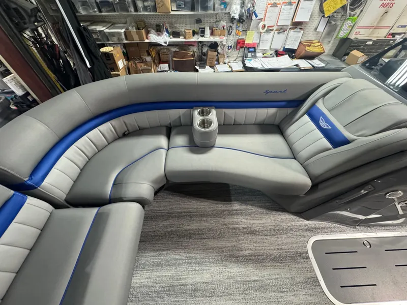 Slide: The Image of Luxurious seating in 2025 Bennington 24 LXSSB boat with gray and blue upholstery. - 4
