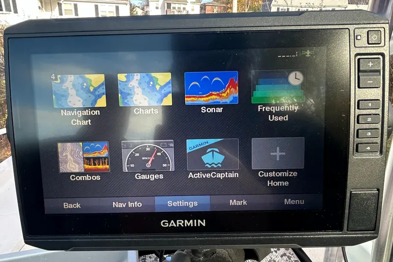 Slide: The Image of Garmin marine GPS display on a 2018 Mako 19 CPX boat, showing navigation and sonar options. - 18